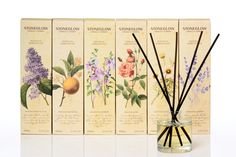 an assortment of reed diffuses with flowers in them