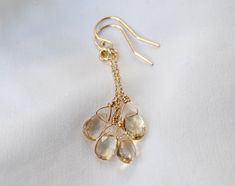 This listing is for a pair of lemon quartz dangle earrings made with 14k gold filled chain and rings and hung on ear wires of your choice. These stones are beautiful, pale yellow and are beautifully faceted.  The lemon quartz are beautiful teardrop shaped stones, natural and faceted. Length from top of ear wires - 1-3/4 inch Arrives beautifully gift wrapped Nickel-free Citrine Dangle Jewelry, Yellow Gold Citrine Dangle Jewelry, Yellow Wire Wrapped Drop Earrings, Wire Wrapped Citrine Dangle Jewelry, Citrine Dangle Earrings As A Gift, Yellow Wire Wrapped Dangle Jewelry, Yellow Dangle Jewelry For Everyday, Everyday Yellow Dangle Jewelry, Girlfriend Jewelry