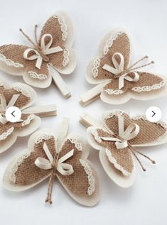 four pieces of fabric with bows and lace on them are arranged in the shape of a butterfly