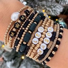 Stacking Beaded Bracelets Diy, Diy Ermish Bracelets, Diy Stacking Bracelets, Black And Gold Bracelet Stack, Handmade Jewelry Small Business, Beaded Stack Bracelets, Stacked Bracelet Ideas, Small Beads Bracelets Ideas, Bead Bracelet Stack Ideas