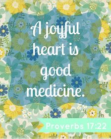 a blue and yellow flowered background with the words, a joyful heart is good medicine