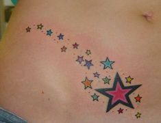 a woman's back with colorful stars on it