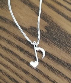 New Handmade Heart Eight Note Necklace ♡ Wear your love for music close to your heart. ♡ 18 inch Silver plated chain ♡ Music Note pendant measures 1 inch long ♡ Ships within 24 hours of purchase Monday-Saturday ☆ Music Note Jewelry, Music teacher, chorus, instruments, piano, guitar, drums, Singer, music lover, Handmade jewelry, Handmade necklace, Mother's day, Easter, Graduation, Birthday, Gift Instruments Piano, Music Note Jewelry, Valentine Jewellery, Necklace Music, Eighth Note, Large Dangle Earrings, Summer Beach Jewelry, Piano Guitar