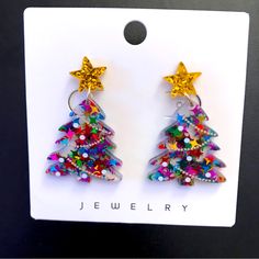 Christmas-Holiday Green Red Blue- Multi Color With Gold Star Top Tree Post Dangle Earrings! Sparkly, Fun Glittery Shiny Earrings! Perfect For The Holidays To Wear Or Give As A Gift! Lightweight. Nwot! Measurements Approximate: 1.75” Length 1” Width Smoke Free Home! Christmas Star-shaped Jewelry For Parties, Christmas Party Star-shaped Jewelry, Christmas Star-shaped Party Jewelry, Multicolor Christmas Earrings, Shiny Earrings, Star Tree, Star Top, Resin Earrings, Gold Star