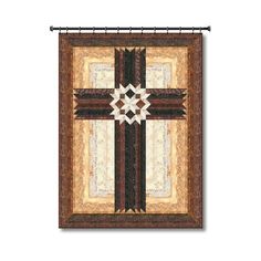 a quilted wall hanging with a cross on it