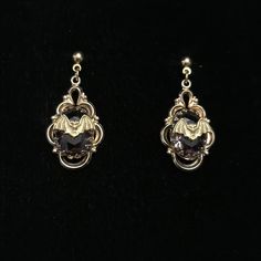 These are Victorian style filigree drops with a gold brass bat hang from a gold filled post earring. The delicate, gold plated, open work earrings have a .5 inch purple cut glass stone. They are very lightweight and drop to about 1.25 inches.  The tiny bat added to the circa 1950's earrings measure a little under .5 inch. This piece of jewelry is sent in a bubble pack envelope via US postal service, first class mail with insurance and packed in a gift box. International rate is $23. Buyers are responsible for any customs and import taxes that may apply. These fees are taken by your country, not Etsy. Necromance is not responsible for delays due to customs. Victorian Gothic Earrings, 1950s Earrings, Work Earrings, Bat Jewelry, Bubble Pack, Earrings Gothic, Vintage Earring, Jewelry Gothic, Bat Earrings