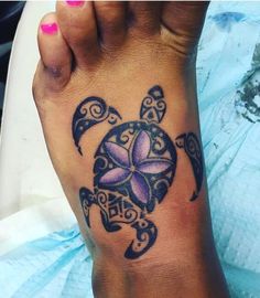 a woman's foot with a tattoo design on it