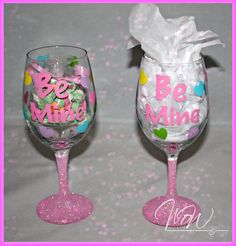 two wine glasses that have candy in them