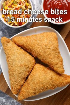 fried cheese bites on a white plate next to a bowl of salad and dipping sauce