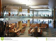 the inside of an office building with tables and chairs