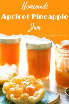 homemade apricot pineapple jam in jars on a blue plate next to cookies