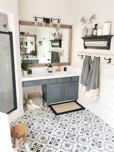 a bathroom with black and white tile flooring