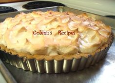 a pie sitting on top of a metal pan next to a stove with the words golden's recipes written above it