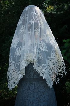 "Evintage Veils~ In an incredibly intricate, beautiful embroidered lace, this soft, ivory veil is of heirloom quality. A medium length mantilla, it provides excellent coverage, and it is soft and comfortable. Measures about 50 X 23 inches. In a long size, here: https://www.etsy.com/listing/1056055539/evintage-veils-mater-dei-heirloom-wrap?ref=shop_home_active_1 Also in an infinity veil here: https://www.etsy.com/listing/960466585/evintage-veilsready-to-ship-mater-dei?ref=shop_home_active_41& Vintage Lace With Lace Trim For Ceremony, Cream Lace Veil With Lace Work, Vintage Embroidered Lace For Wedding, Cream Bohemian Lace With Lace Trim, Bohemian Cream Lace With Lace Trim, Traditional Crochet Lace For Wedding, Vintage Cream Lace For Ceremonies, Victorian Lace For Wedding, Vintage Cream Lace For Ceremony