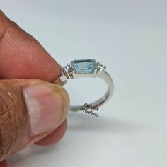 BAND - ROUNAK JEWELLERS MATERIAL - 925 STERLING SILVER GEMSTONE - 100% NATURAL AQUAMARINE AQUAMARINE STONE WEIGHT - 0.75 CARAT AQUAMARINE STONE SIZE - 4 x 6 MM SECONDARY STONE - CUBIC ZIRCONIA ZIRCONIA STONE WEIGHT - 0.15 CARAT ZIRCONIA STONE SIZE - 2.50 MM GROSS WEIGHT - 2.640 GM STONE SHAPE - BAUGETTE, ROUND GEM COLOUR - BLUE, WHITE RING SIZE - ALL SIZE AVAILABLE PLEASE GIVE YOUR OPENION OR FEEDBACK ABOUT THE PRODUCT. WE ACCEPT BULK ORDER ALSO. https://www.etsy.com/in-en/shop/RounakJewellers?r Adjustable Sterling Silver Topaz Ring With Accent Stones, Stackable Emerald Cut Sterling Silver Rings, Adjustable Blue Topaz Rings For Anniversary, Stackable White Gold Rings With Blue Topaz, Aquamarine Gem, Turquoise Accents, Aquamarine Ring, March Birthstone, Aquamarine Stone