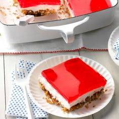 a piece of cake on a paper plate with a fork and spoon next to it