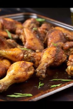 chicken wings on a plate with garnish and seasoning