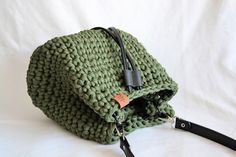 Crocheted handbag - BUCKET BAG* with shoulder strap (not adjustable), PU leather bottom, leather closing strap and two inside pockets. SIZE: 25x22x10 cm MATERIAL: 90% cotton, 10% polyester (fabric yarn - made from apparel/textile industry waste) COLOUR: Green, black. *item in the picture is the one you are getting Casual Green Bucket Satchel, Green Hobo Bag With Adjustable Strap And Double Handle, Green Shoulder Bag With Adjustable Strap For Shopping, Green Cotton Hobo Bag For Travel, Cotton Shoulder Bag With Adjustable Strap For Errands, Casual Green Hobo Bag With Handles, Casual Green Bucket Shoulder Bag, Casual Green Shoulder Bucket Bag, Green Bucket Bag With Top Carry Handle