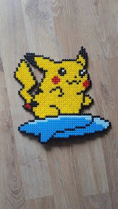 a piece of art made to look like a pikachu with a blue object in it