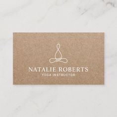 a yoga instructor business card with the logo for natalie roberts's yoga instructor on it