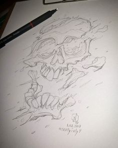 a pencil drawing of a skull on paper