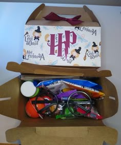 an open cardboard box filled with assorted items