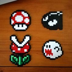 four pieces of pixel art made to look like mario and luigi's mushroom house