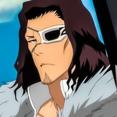 a man with long hair and sunglasses on his face