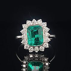 Gorgeous 14K WHITE GOLD ring Gem GREEN Colombia emerald. Center set Gem lab flux growth green Colombia emerald in emerald shape weight 1.75ct. size 8.5x7mm very nice rich vivid green color nice luster, lively ,nice cut,Sparkly emerald. side set 16 natural round diamonds total weight 0.64ct. H-VS Ring size 7.5 Retail Value $6,500 net Appraisal available Formal Emerald Ring With Halo Setting, Gia Certified Emerald Cut Fine Jewelry Gemstones, Gia Certified Emerald Cut Gemstone For Fine Jewelry, Luxury Emerald Cut Emerald Cluster Ring, Luxury Green Gemstones With Halo Setting, White Gold Gemstone With Emerald Brilliant Cut, Gia Certified Octagon Emerald Ring In White Gold, Gia Certified White Gold Octagon Emerald Ring, Gia Certified Octagon Emerald Ring