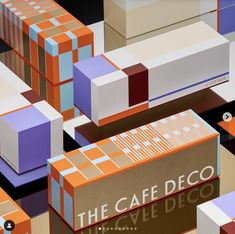 colorful boxes are stacked on top of each other with the words cafe deco in them