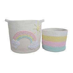 two white baskets with rainbows and clouds painted on the sides, one has a sun