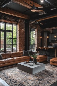 a living room filled with furniture and lots of windows