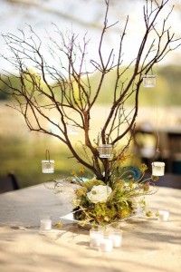 an image of a tree that is in the middle of a table with candles on it