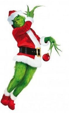 the grinch is dressed in santa claus's suit and holding a christmas ornament