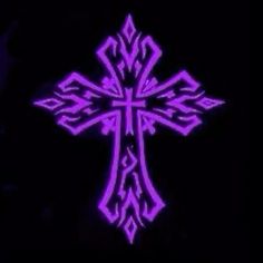 the cross is glowing purple in the dark