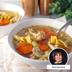 two bowls of soup with carrots, noodles and meat in them next to a woman's face