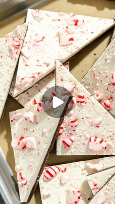 white chocolate and peppermint barkies are arranged on a baking sheet to be cut into squares