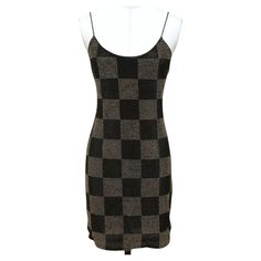 GUARANTEED AUTHENTIC ALICE + OLIVIA NELLE MINI DRESS Retailed excluding sales taxes $595. Design: - NELLE style black checkerboard embellished mini dress. - Spaghetti straps. - Rear zipper closure. - Fully lined. Fabric: 91% Nylon, 9% Elastane Size: 6 Measurements (Approximate Laid Flat, Light Stretch To Material): - Underarm to Underarm, 15" - Waist, 13.5" - Hip, 15" - Total Length, 25" (front center neckline to bottom front center hem) To Our Customers: - We consider it a privilege to serve as your luxury fashion concierge. Whether you are looking to buy that special one-of-a-kind item, (that no one else can find), scoring a spectacular deal on a pre-owned gem or updating your own style by consigning your items, please don't hesitate to contact us. Remember, You Deserve No Less! Overall Luxury Fitted Dress With Spaghetti Straps, Elegant Plaid Dress For Party, Fitted Plaid Dresses With Spaghetti Straps, Elegant Fitted Plaid Mini Dress, Plaid Fitted Mini Dress For Party, Designer Black Sleeveless Dress, Chic Plaid Dress For Night Out, Fitted Plaid Dress For Night Out, Black Fitted Designer Mini Dress