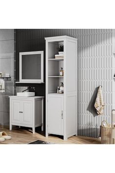 a bathroom with a sink, cabinet and towel rack