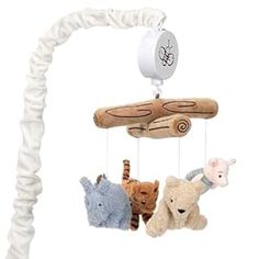 a baby crib mobile with stuffed animals hanging from it