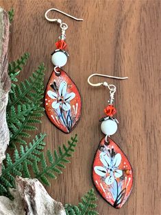 Artisan Orange Copper Earrings, Artisan Hand Painted Orange Jewelry, Artisan Hand-painted Orange Jewelry, Artsy Orange Drop Earrings, Orange Enamel Earrings For Gifts, Handmade Enamel Drop Flower Earrings, Orange Enamel Earrings As A Gift, Orange Enamel Earrings For Gift, Orange Copper Earrings For Gift