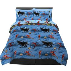 a bed with batman and robin justice characters on the cover, in front of a white background