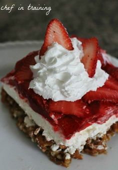 a piece of dessert with strawberries and whipped cream on top