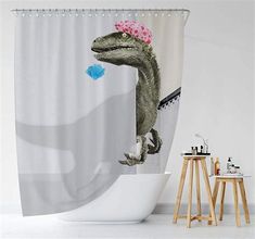 a dinosaur shower curtain with a pink flower in it's mouth and an image of a t - rex on the wall