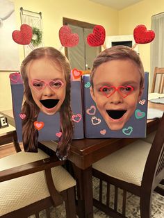 two children's faces with hearts on them are displayed in front of a dining room table