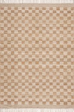 a beige and white rug with squares on it