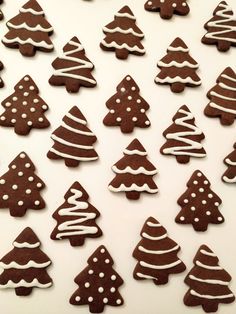 decorated cookies are arranged in the shape of christmas trees