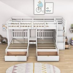 a white bunk bed with drawers underneath it and a rug on the floor next to it