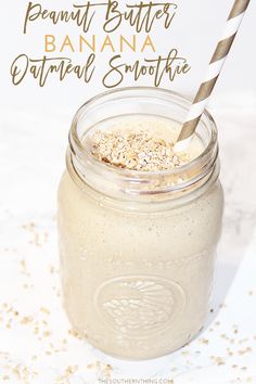 a glass jar filled with oatmeal smoothie on top of a table