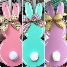 four different colored easter bunnies with bows and cotton balls in the shape of rabbits